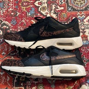 Gently worn Womens Nike Black Gold Leopard Sneakers size 10.5